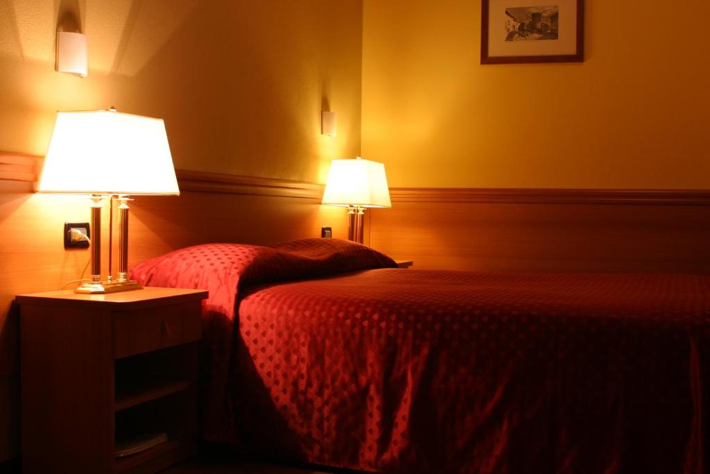 Postel nebo postele na pokoji v ubytování Air Hotel
