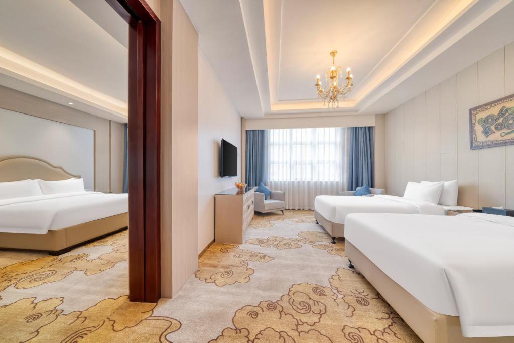 Postel nebo postele na pokoji v ubytování Dayhello Hotel Shenzhen Shekou