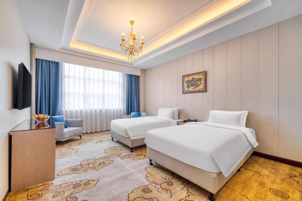 TV a/nebo společenská místnost v ubytování Dayhello Hotel Shenzhen Shekou