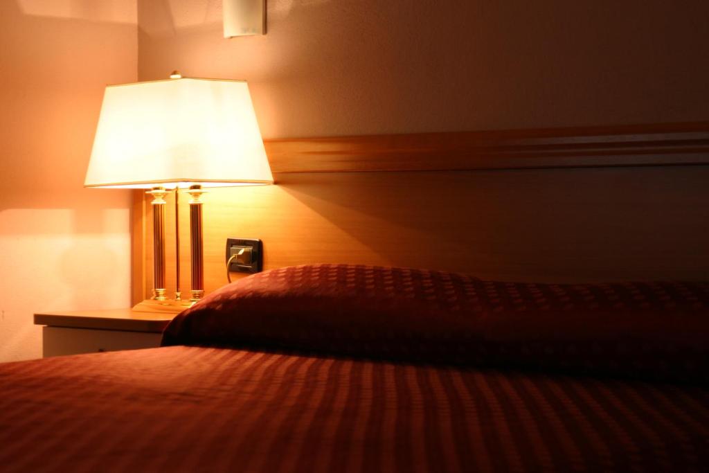 Postel nebo postele na pokoji v ubytování Air Hotel