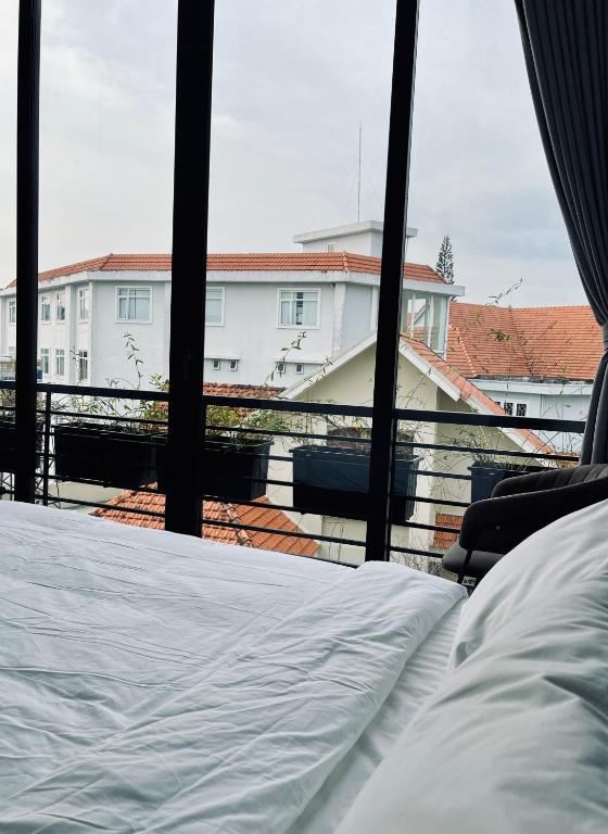 Postel nebo postele na pokoji v ubytování Ben Ben Hotel