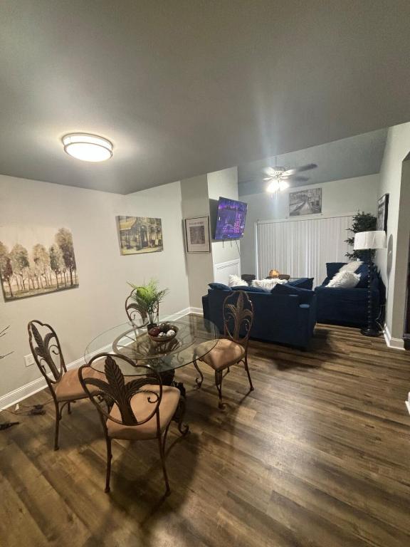 a living room with a table and a couch at Perkins Cove in Baton Rouge