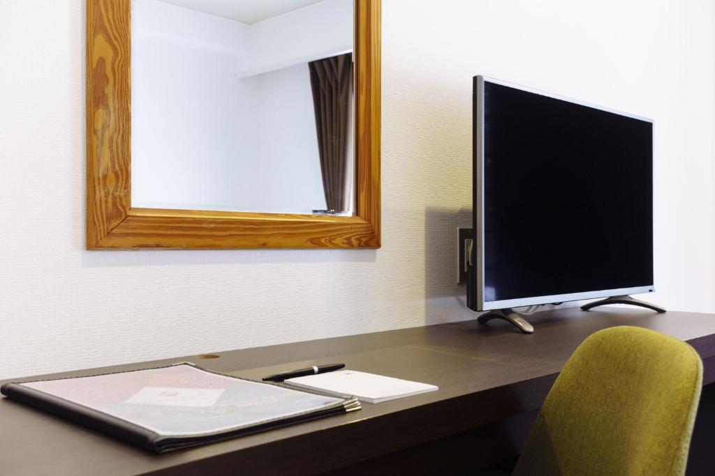 TV a/nebo společenská místnost v ubytování Hakuba Gateway Hotel