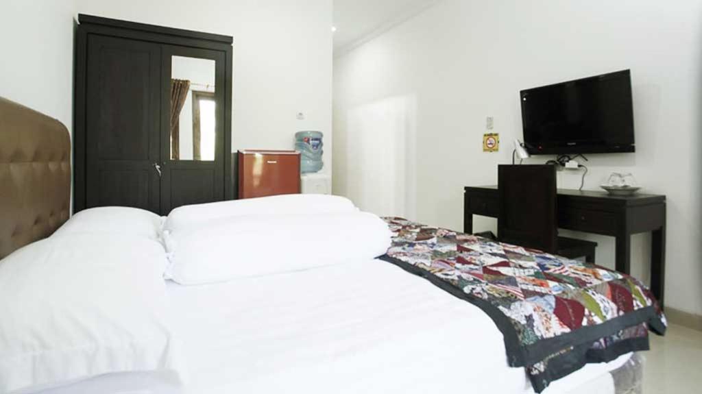 Postel nebo postele na pokoji v ubytování Andelis Homestay