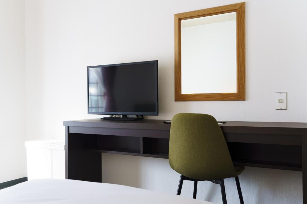TV a/nebo společenská místnost v ubytování Hakuba Gateway Hotel