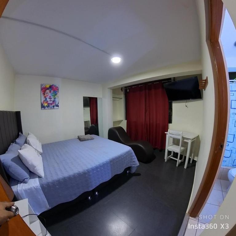 Postel nebo postele na pokoji v ubytování Hostal El Bosque