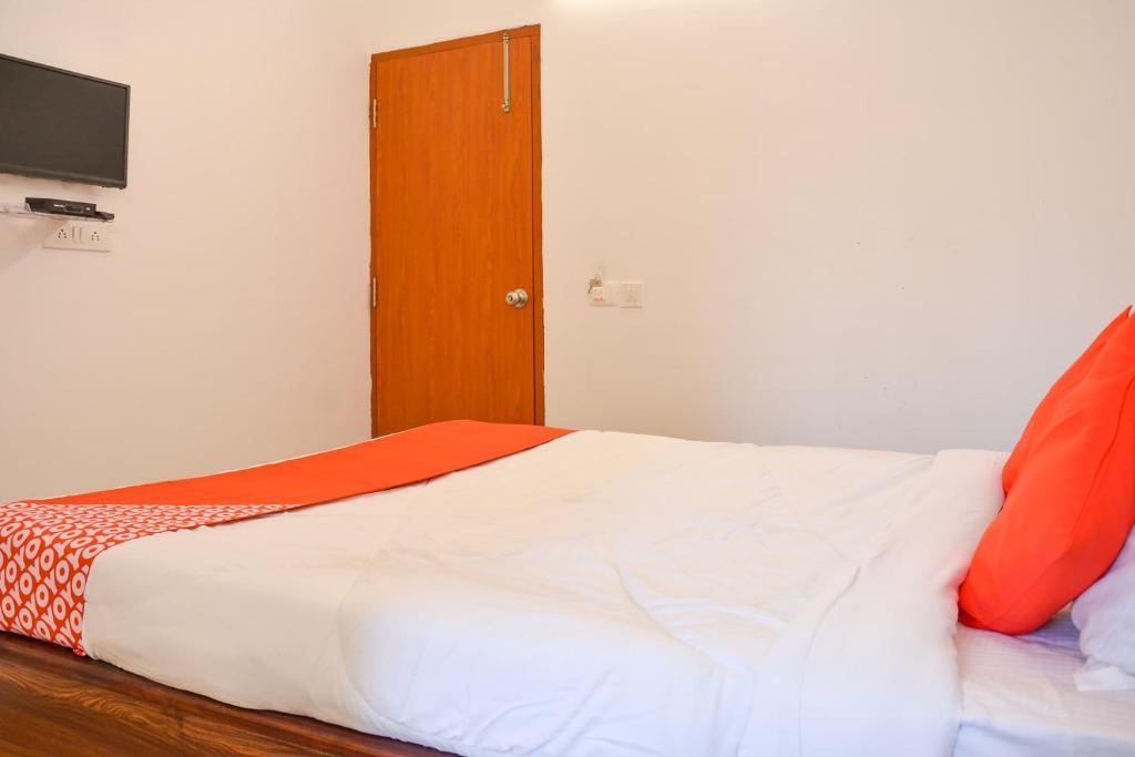 Postel nebo postele na pokoji v ubytování Super Collection O Sayhallo Kanchan
