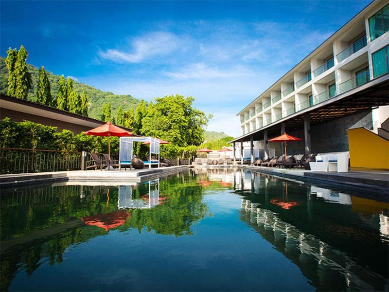 a large pool of water in front of a building at Oh La La Koh Phangan in Haad Rin
