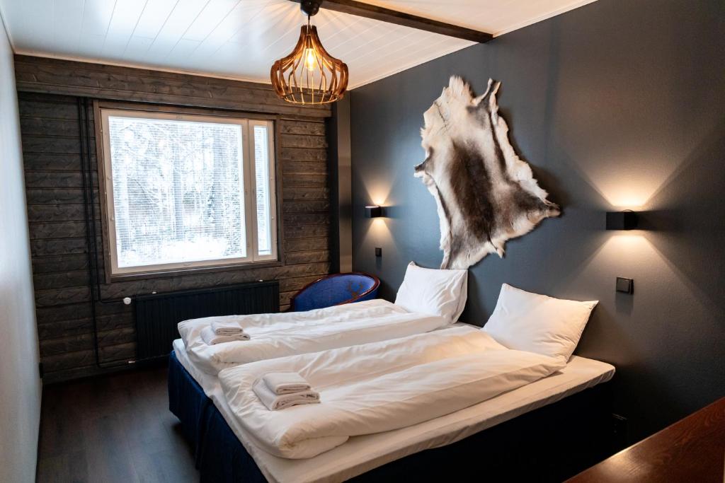 Postel nebo postele na pokoji v ubytování Hotel Metsähirvas