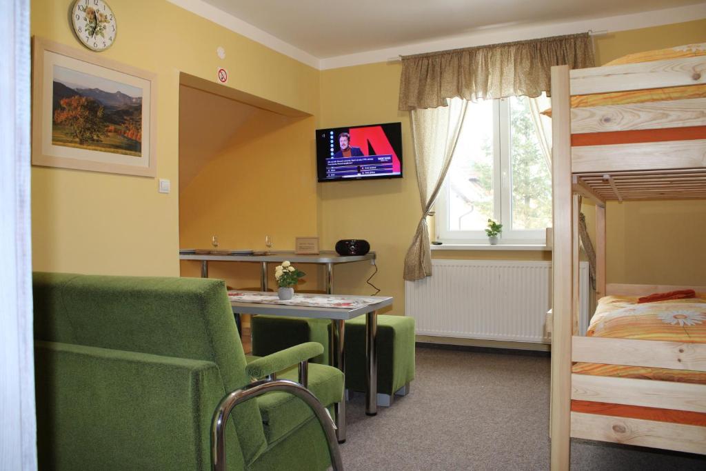 Postel nebo postele na pokoji v ubytování Penzión u Jurka Zuberec