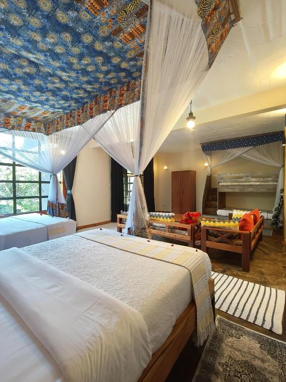 Postel nebo postele na pokoji v ubytování Punda Milias Lodge