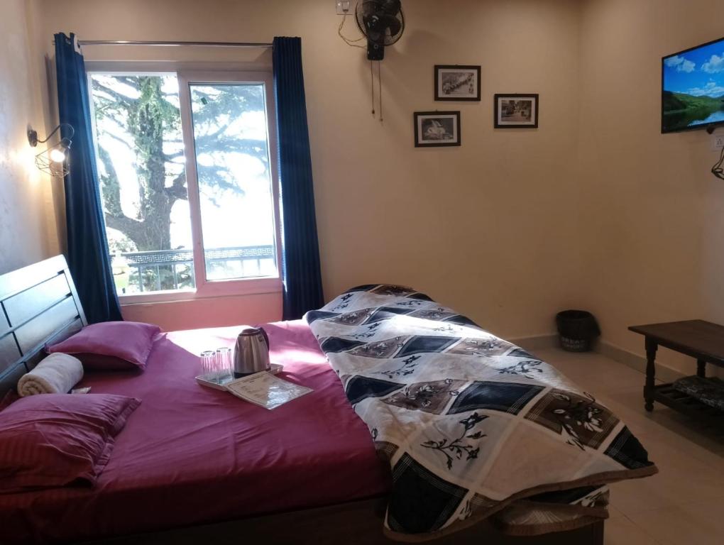 Postel nebo postele na pokoji v ubytování Himalayan view stay - Pahado wala ghar