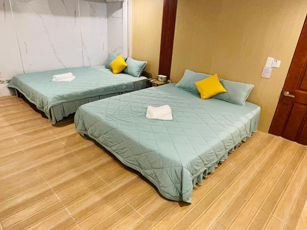 Postel nebo postele na pokoji v ubytování Motel Khánh Nhi