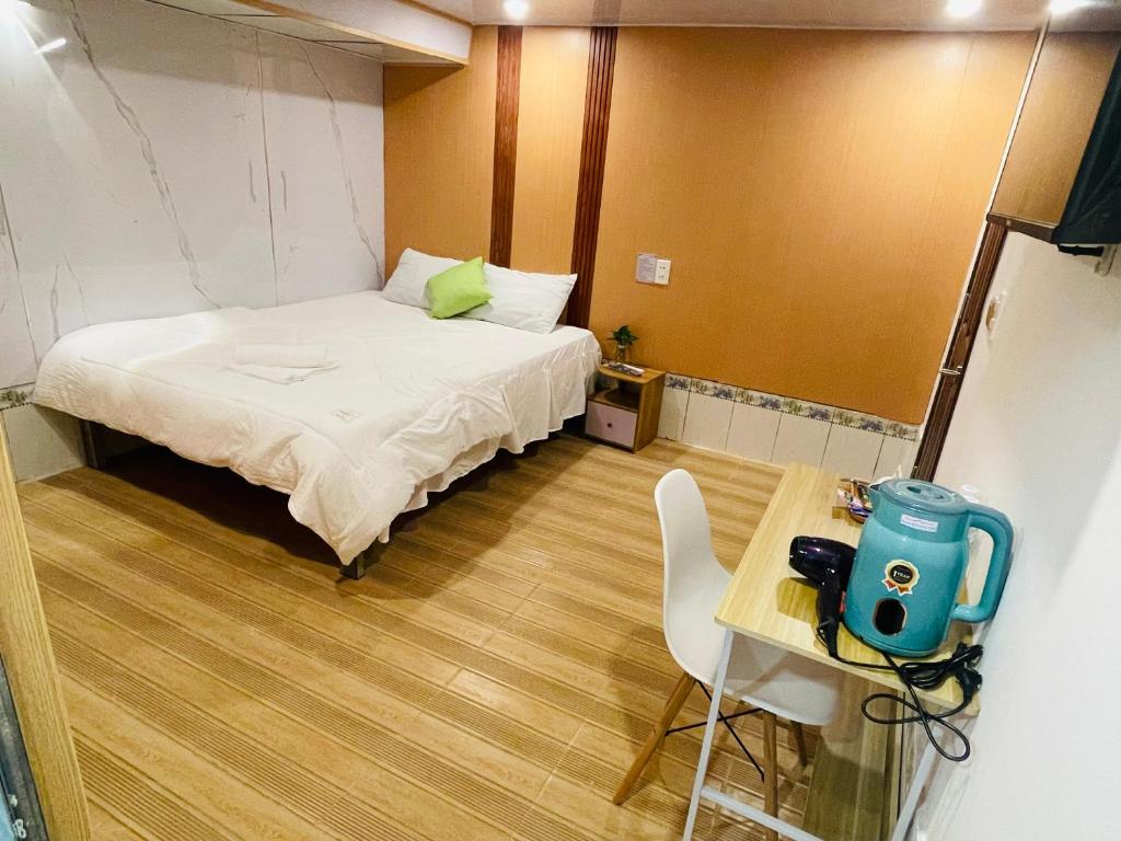 Postel nebo postele na pokoji v ubytování Motel Khánh Nhi