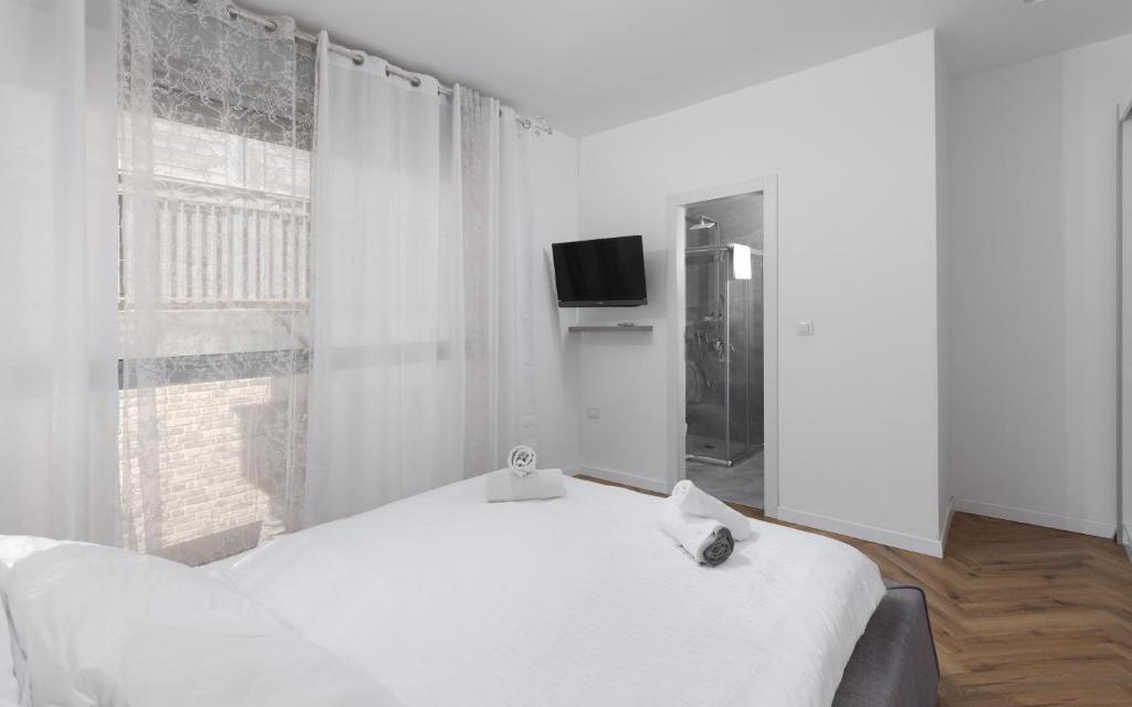 Ein Bett oder Betten in einem Zimmer der Unterkunft Sahara - Designed Duplex with a private pool