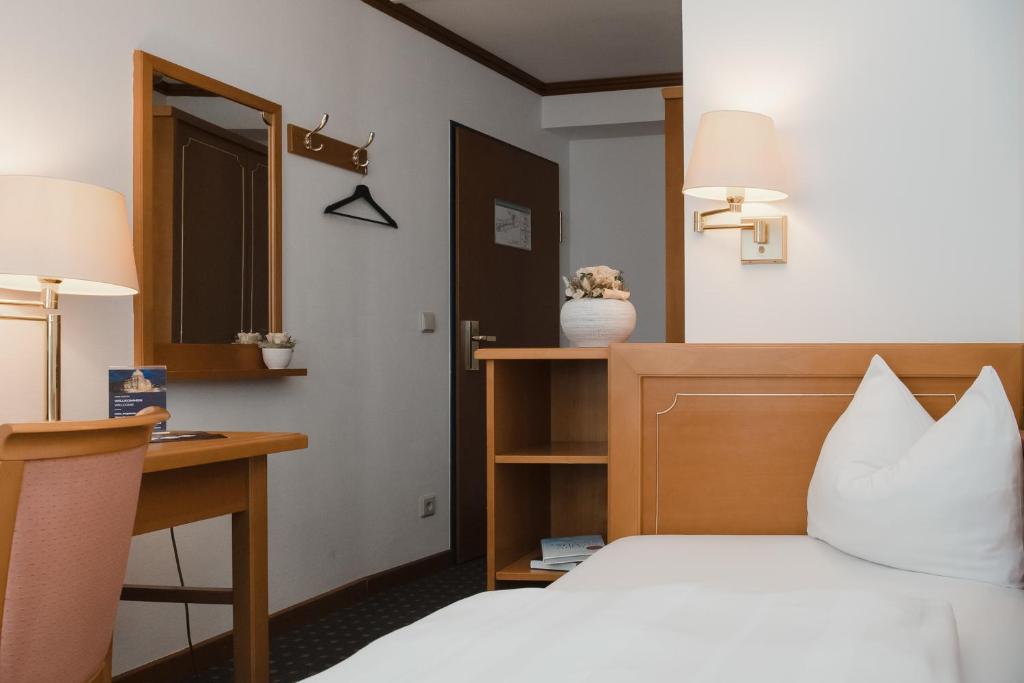 Postel nebo postele na pokoji v ubytování Hotel Alekto