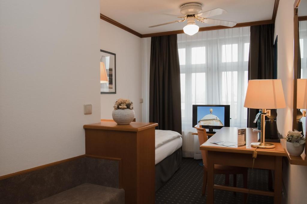 Postel nebo postele na pokoji v ubytování Hotel Alekto