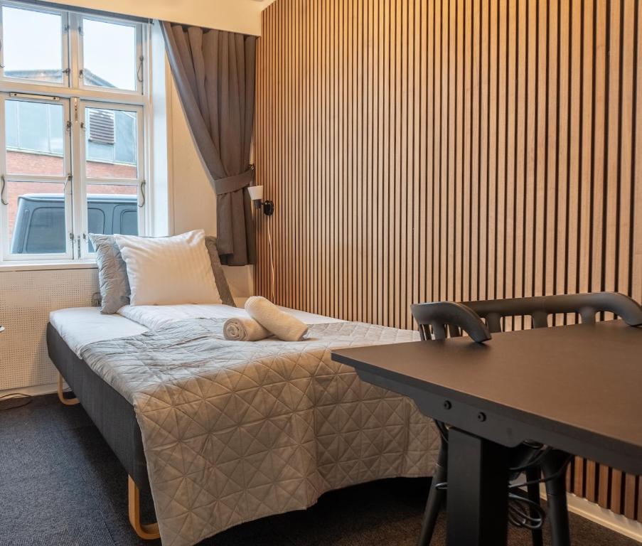 Postel nebo postele na pokoji v ubytování Hotel Assens