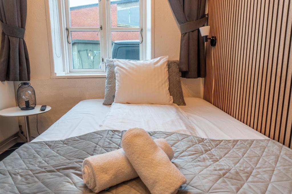 Postel nebo postele na pokoji v ubytování Hotel Assens