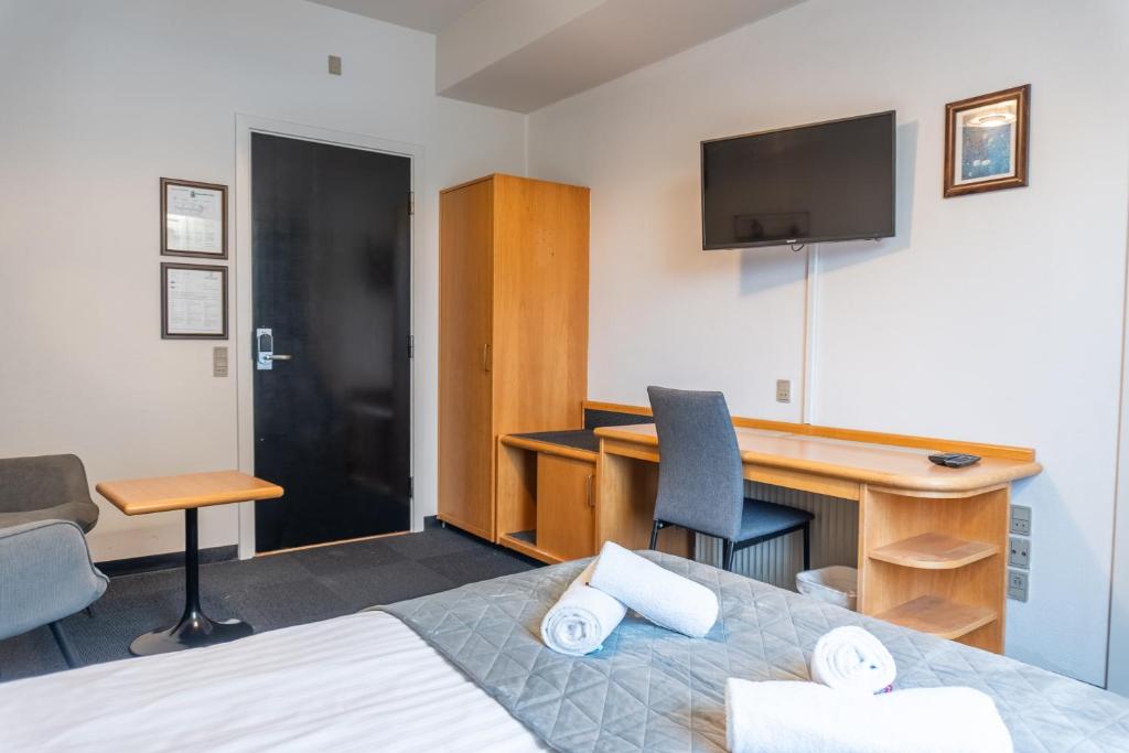 Postel nebo postele na pokoji v ubytování Hotel Assens