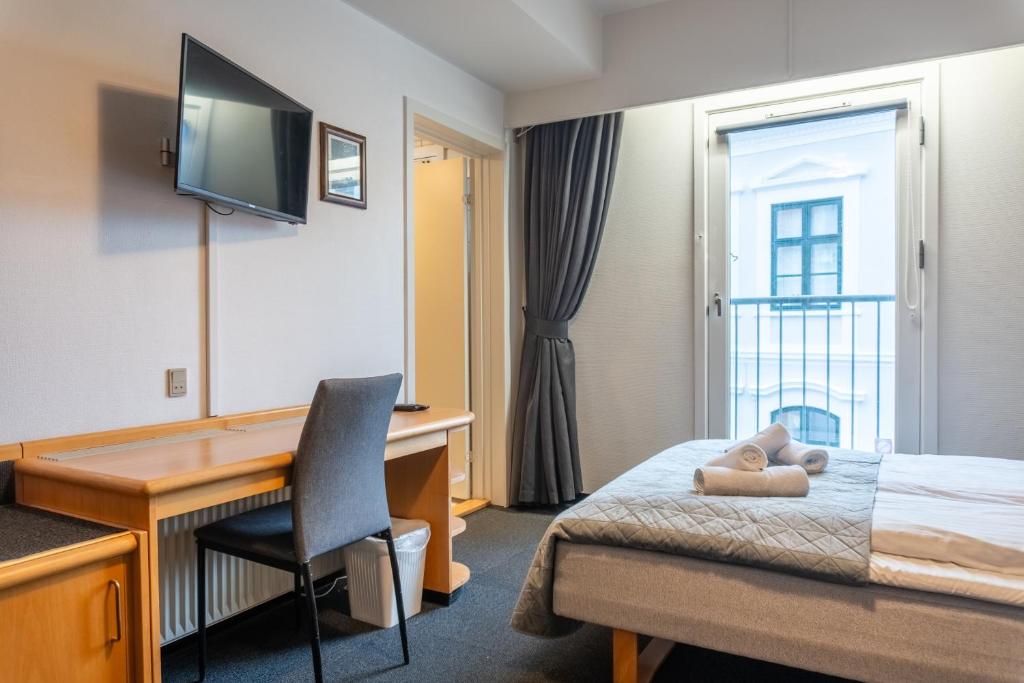 Postel nebo postele na pokoji v ubytování Hotel Assens
