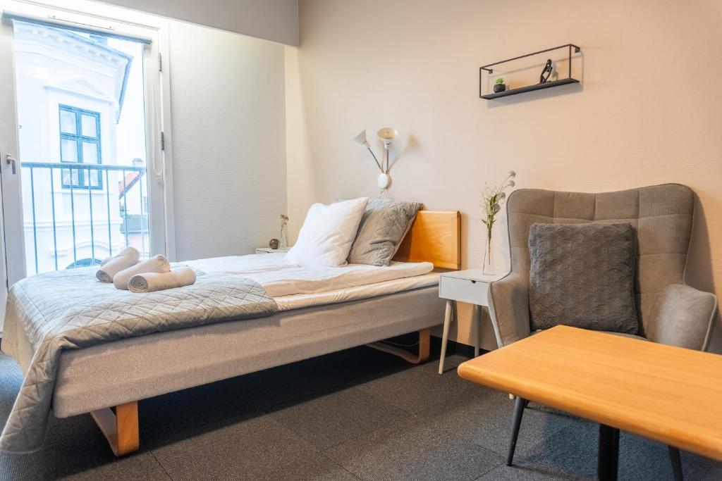 Postel nebo postele na pokoji v ubytování Hotel Assens