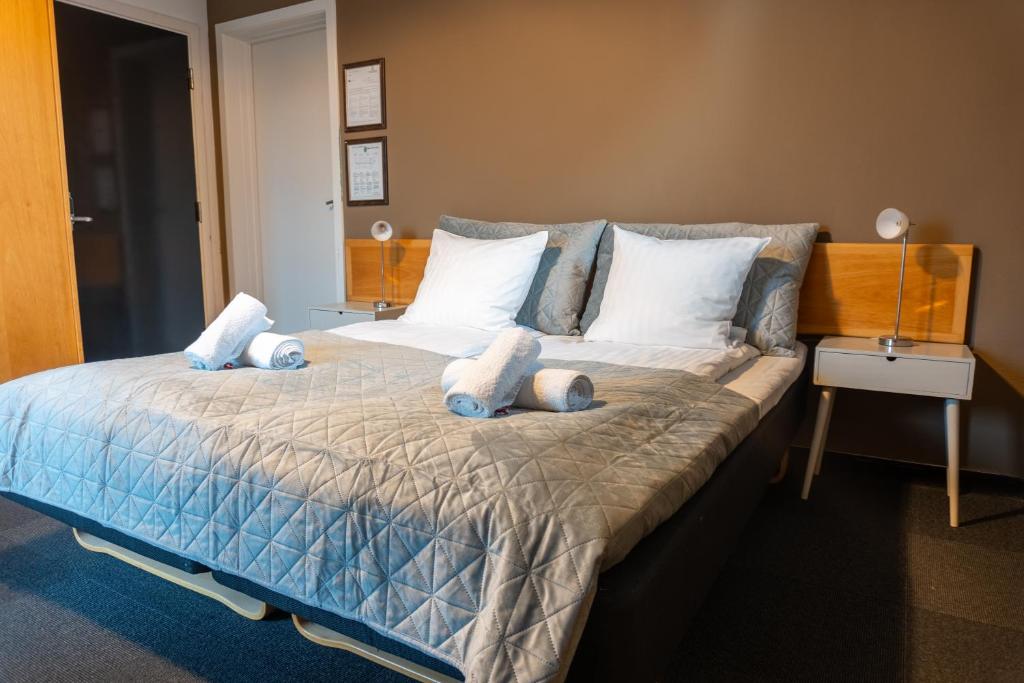 Postel nebo postele na pokoji v ubytování Hotel Assens