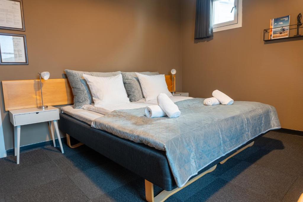Postel nebo postele na pokoji v ubytování Hotel Assens