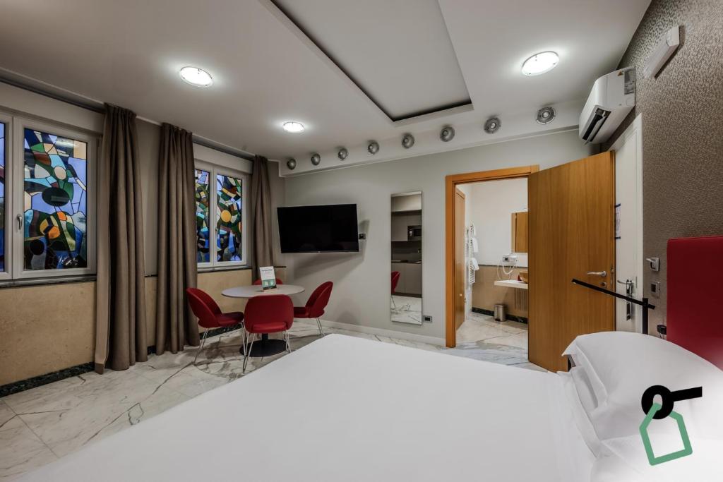 TV a/nebo společenská místnost v ubytování HOTIDAY Apartment Collection - La Spezia