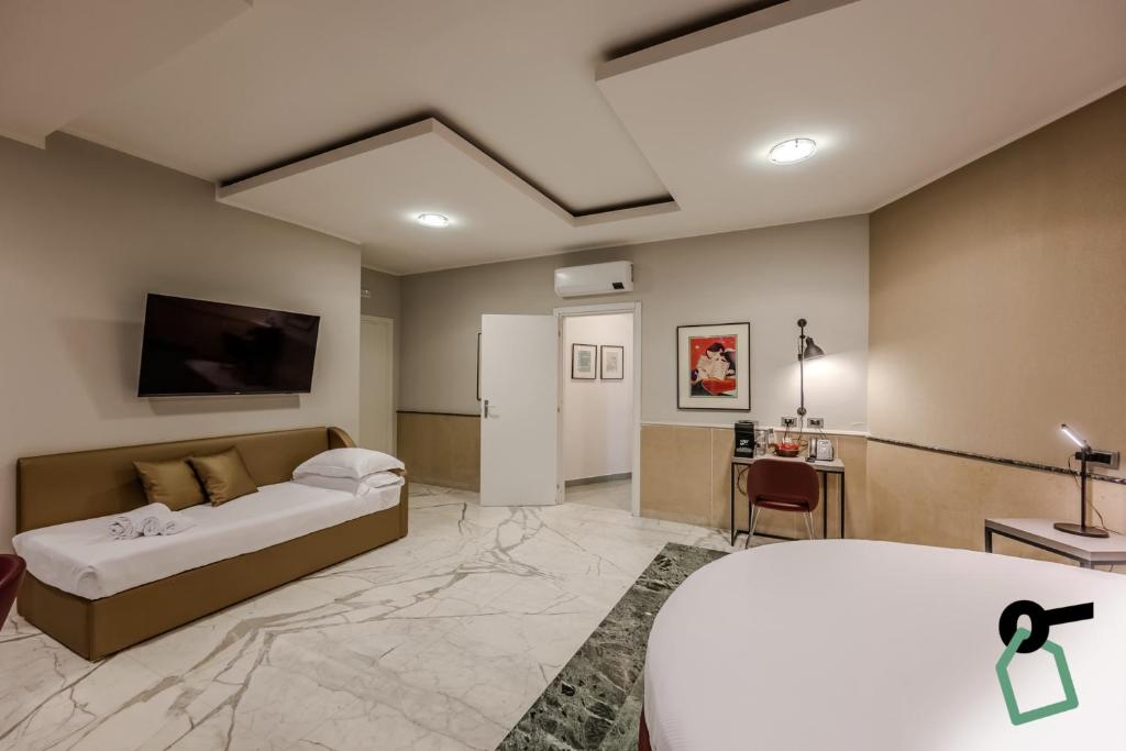 Postel nebo postele na pokoji v ubytování HOTIDAY Apartment Collection - La Spezia