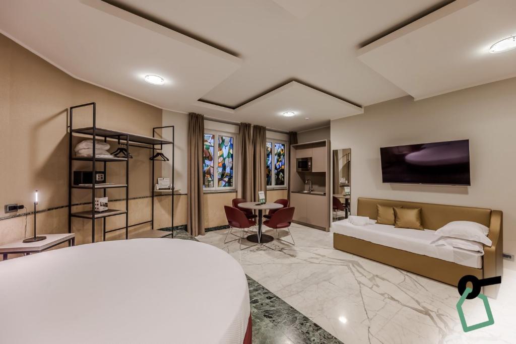TV a/nebo společenská místnost v ubytování HOTIDAY Apartment Collection - La Spezia