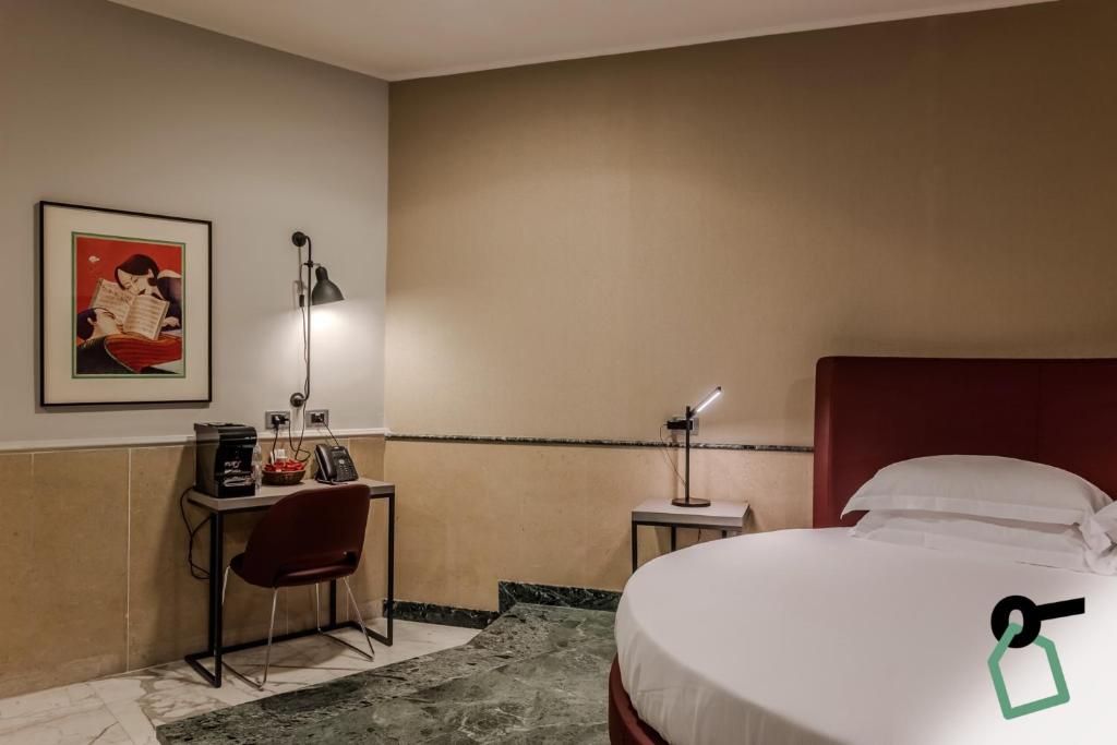 Postel nebo postele na pokoji v ubytování HOTIDAY Apartment Collection - La Spezia