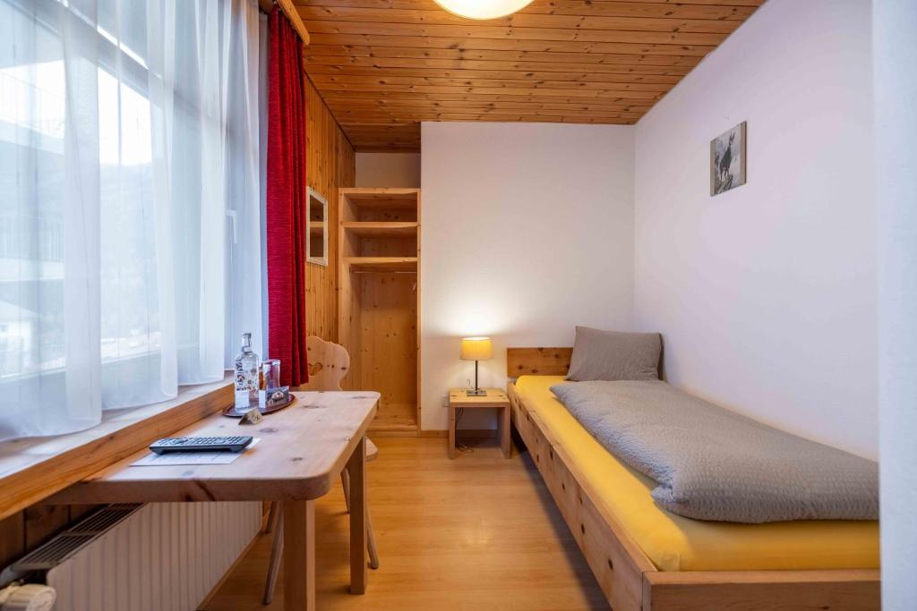Postel nebo postele na pokoji v ubytování Garni Alpenrose - Grusaida