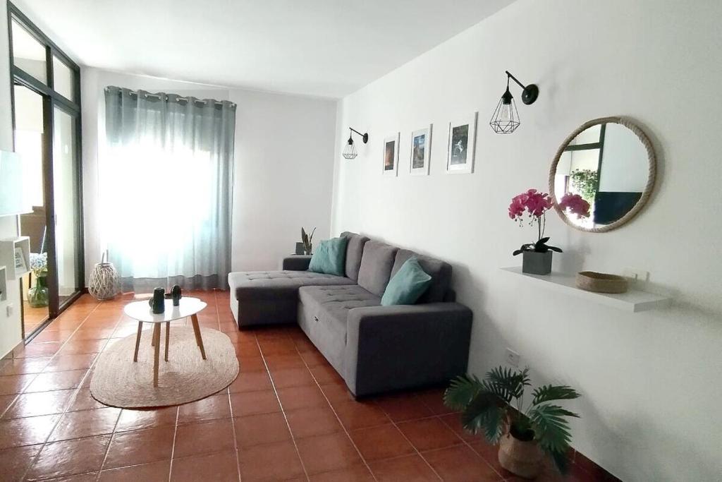 a living room with a couch and a table at Santiago Beach en Playa Santiago in Alajeró