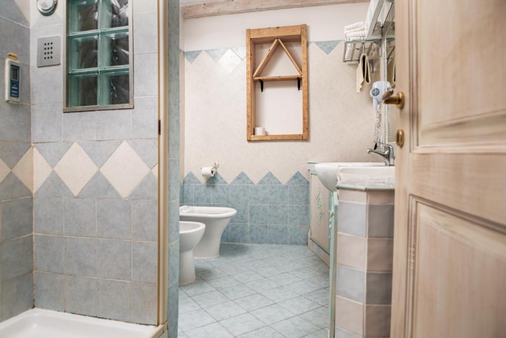 Koupelna v ubytování Locanda Domus De Vida