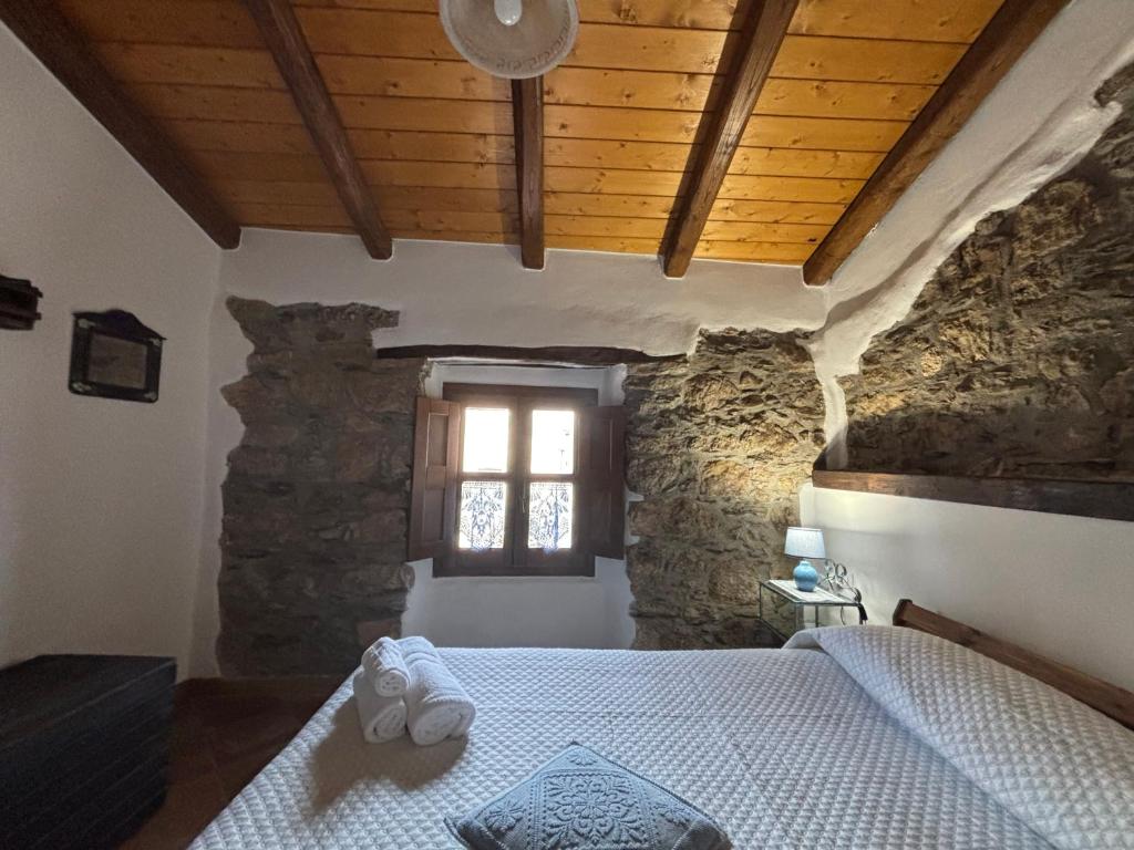 Postel nebo postele na pokoji v ubytování Osini Ecciu Home