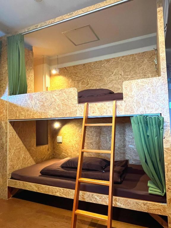 Postel nebo postele na pokoji v ubytování Green Guesthouse