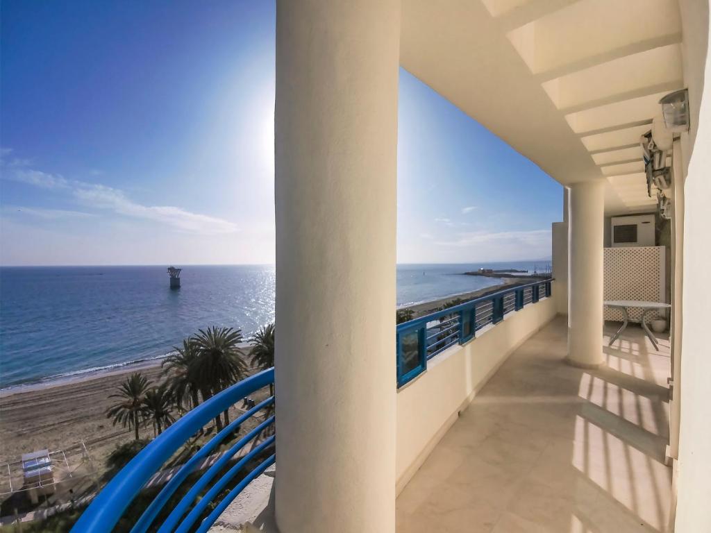 a balcony with a view of the ocean at Banana Beach in Marbella