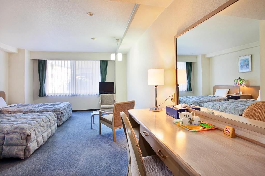 Postel nebo postele na pokoji v ubytování Hotel Luna Park