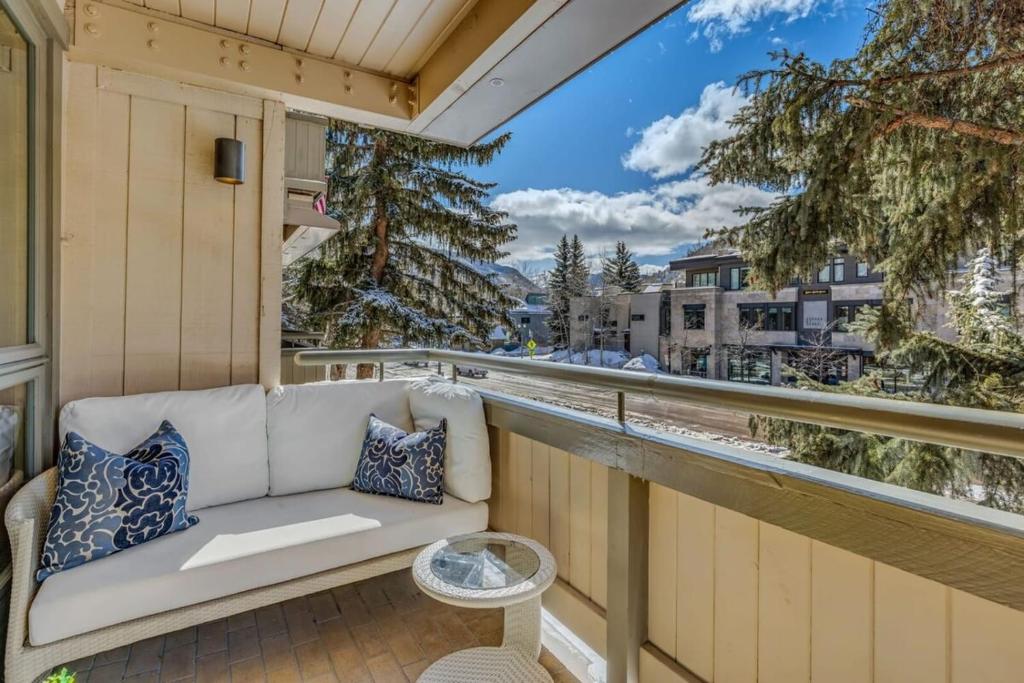 a couch on a balcony with a view at New Listing 2BR 2BA Condo - Mountain Views in Aspen