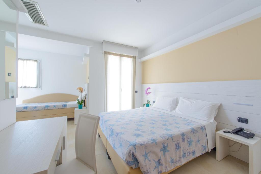 Postel nebo postele na pokoji v ubytování Hotel Sans Souci