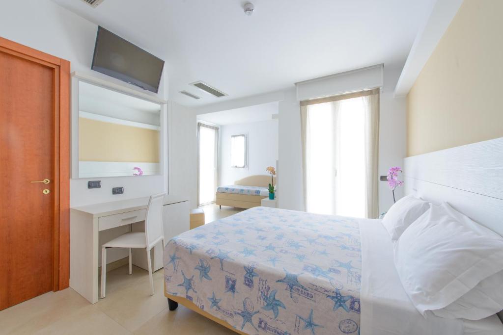 Postel nebo postele na pokoji v ubytování Hotel Sans Souci