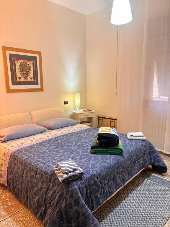 Łóżko lub łóżka w pokoju w obiekcie B&B Camelia