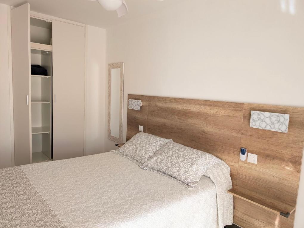 A bed or beds in a room at Apartament Marina