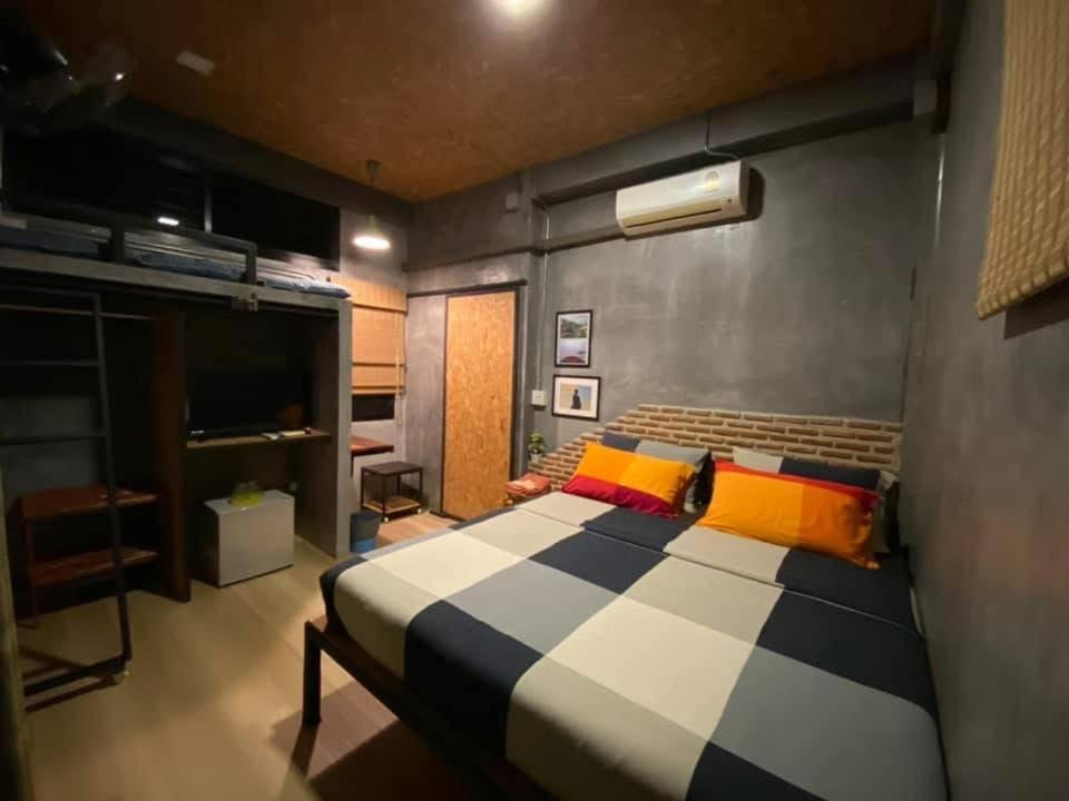 Postel nebo postele na pokoji v ubytování Baan Nork Farmstay บ้านนอก ฟาร์มสเตย์