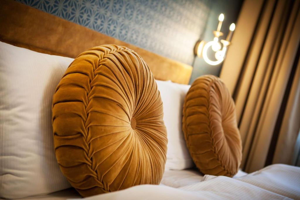 Postel nebo postele na pokoji v ubytování Mestský Hotel Ďumbier