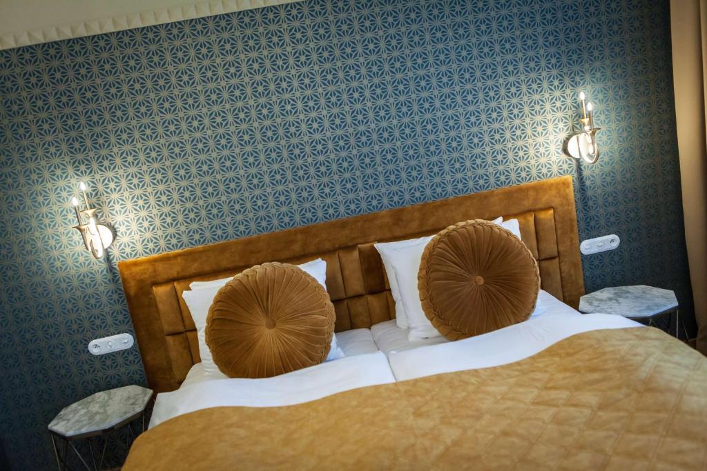 Postel nebo postele na pokoji v ubytování Mestský Hotel Ďumbier