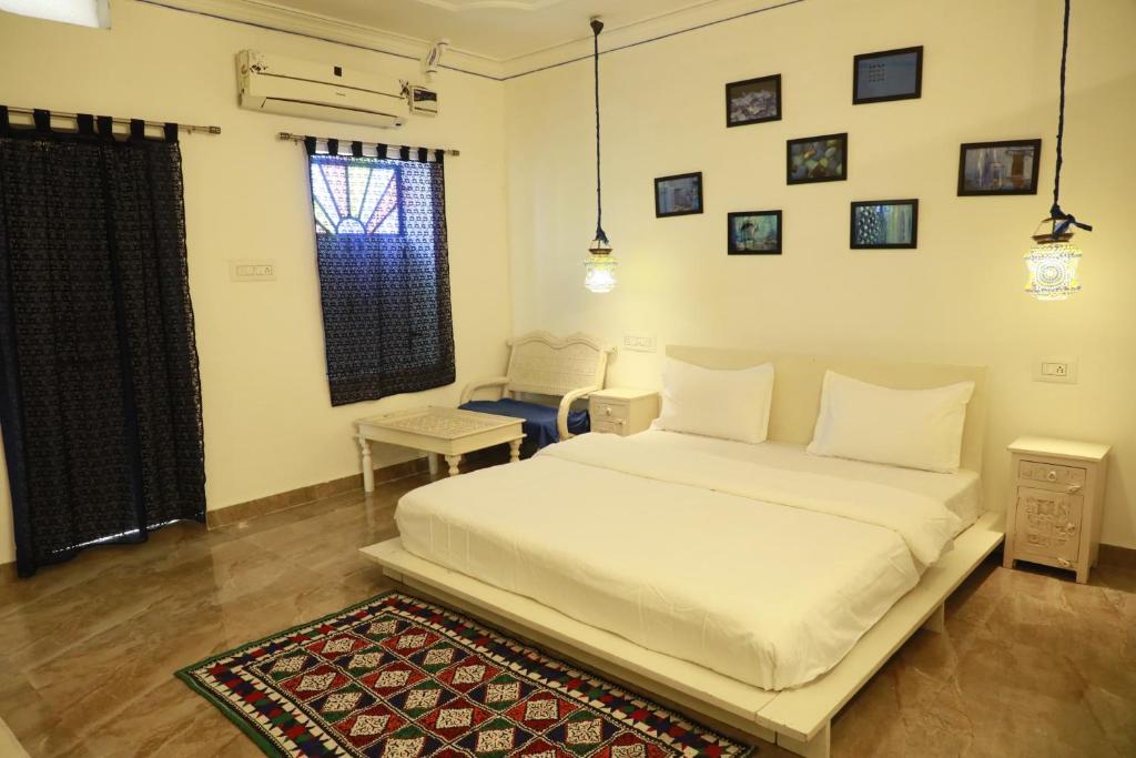 Кровать или кровати в номере Blue Haveli Home Stay