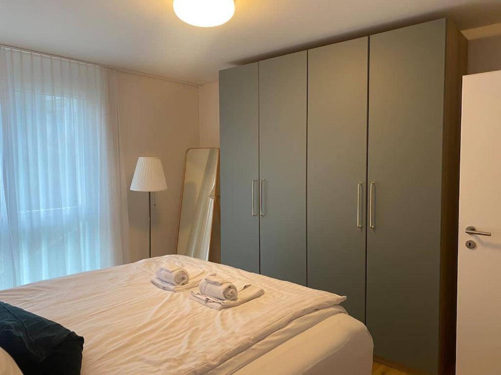 Postel nebo postele na pokoji v ubytování The R Apartment Adlisberg