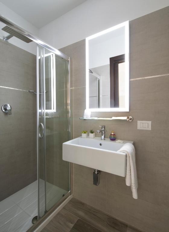 Een badkamer bij Oasi Village Hotel